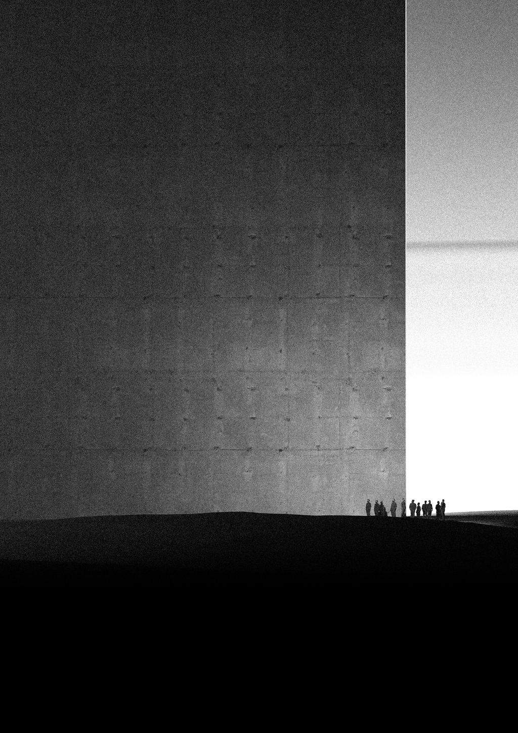 A group of people standing at the edge of a monumental illuminated concrete space.